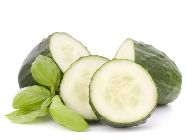 Sliced cucumber vegetable and basil leaves — Stock Photo, Image