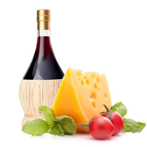 Red wine bottle, cheese and tomato still life — Stock Photo, Image