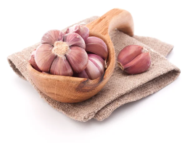 Garlic cloves in wooden bowl — Stock Photo, Image