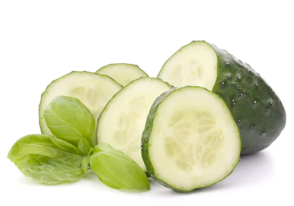 Sliced cucumber and basil leaves — Stock Photo, Image