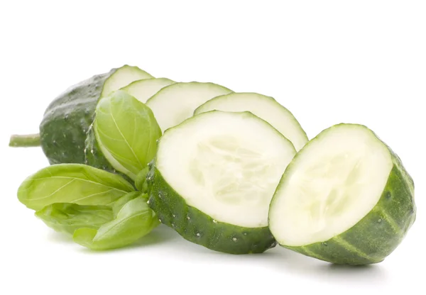 Sliced cucumber vegetable and basil leaves still life — Stock Photo, Image