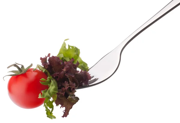 Salad and tomato on fork — Stock Photo, Image