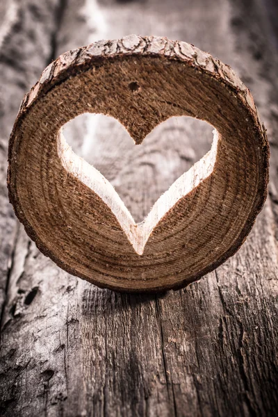 Light  heart on rustic wooden background — Stock Photo, Image