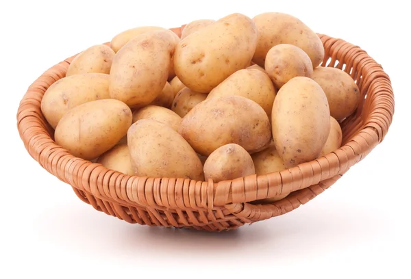Potato tuber in wicker basket — Stock Photo, Image