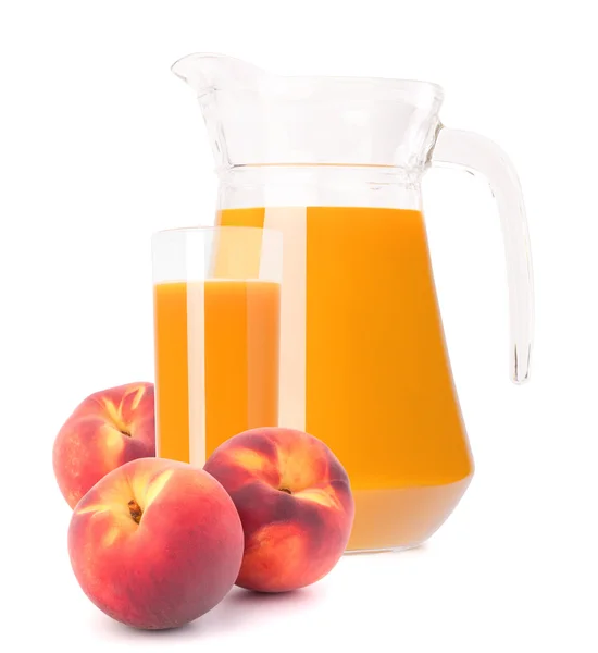 Peach fruit juice in glass jug — Stock Photo, Image