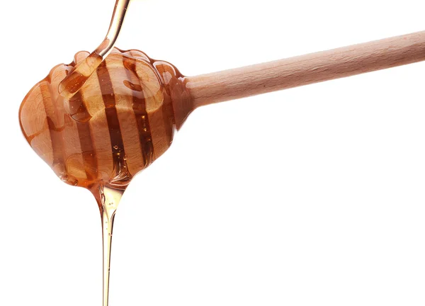木製のディッパーから蜂蜜の滴下 — ストック写真