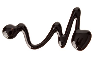 Çikolata şurubu izole üzerinde beyaz arka plan damla. Üstten Görünüm.