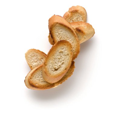 Beyaz arka plan üzerinde izole tost baget dilimleri kapatın. Tost, kızarmış ekmek parçaları. Üstten görünüm.