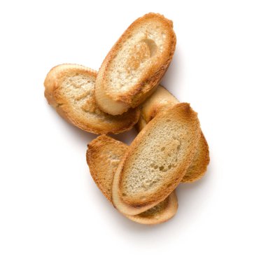 Beyaz arka plan üzerinde izole tost baget dilimleri kapatın. Tost, kızarmış ekmek parçaları. Üstten görünüm.