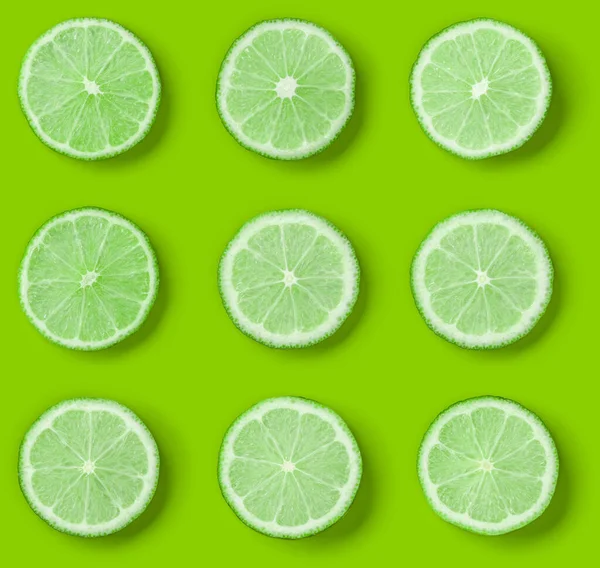 Fruit Pattern Lime Slices Green Background Flat Lay Top View — Stock Photo, Image
