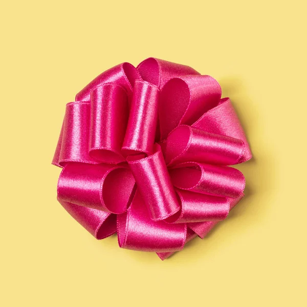 Top View Colorful Festive Bow Isolated Yellow Background Стоковое Изображение