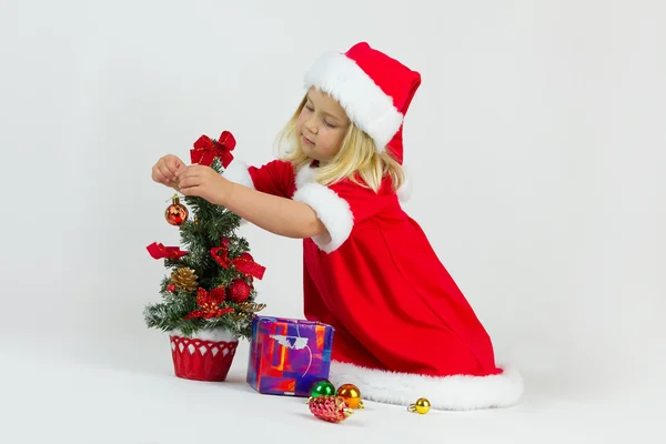Fille dans un costume de Noël rouge — Photo