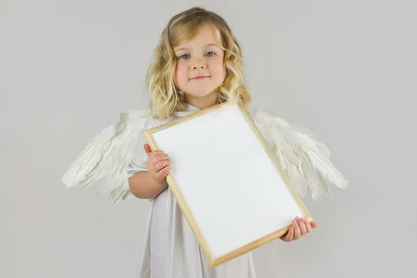 Engel met wit leeg bord — Stockfoto