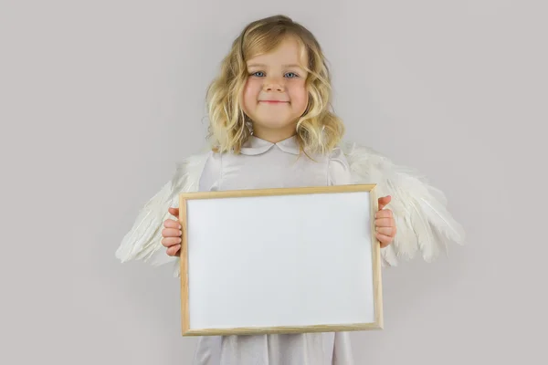Engel met wit leeg bord — Stockfoto