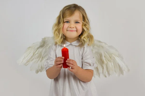 Angel with red candle Royalty Free Stock Images