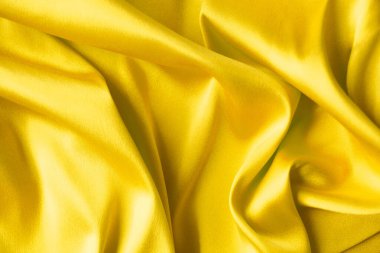 Sarı ipek arkaplan dokusu, tasarım için soyut desen.