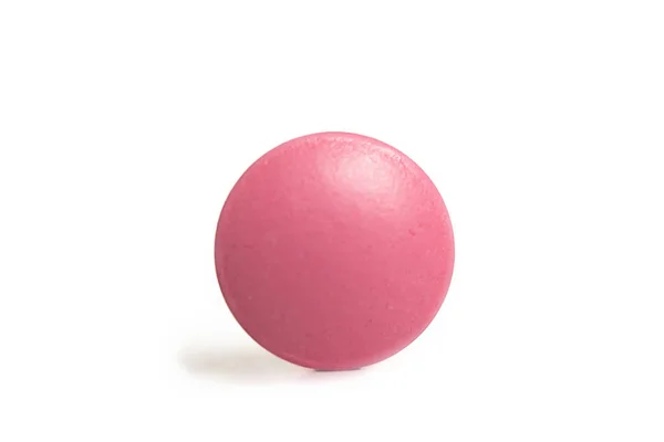 白地に単離されたピンクの丸薬 — ストック写真