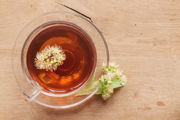 Linden herbal tea on a light pastel background. copy space