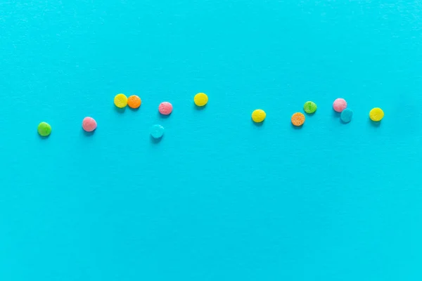 Background of colorful candies. Rainbow topping for topping ice cream and cakes. top view. copy space.