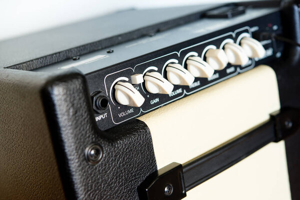 Close-up of the control zone of a combo amplifier for a power tool. Content, bass and presence correction.