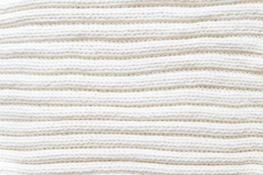 White knitted texture of woolen wool