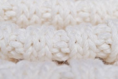 White knitted texture of woolen wool