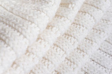 White knitted texture of woolen wool
