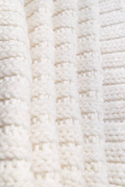 White knitted texture of woolen wool