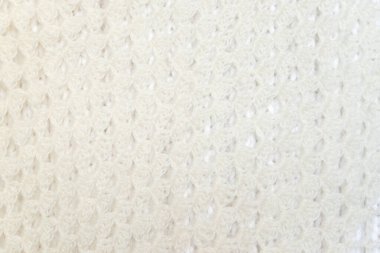 White knitted texture of woolen wool