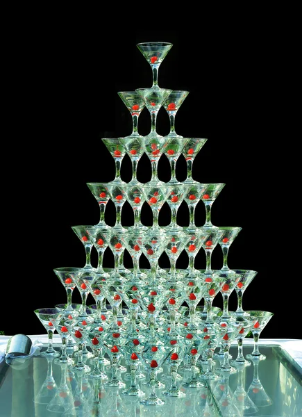 Pyramid holiday glasses on a black background. — Stock Photo, Image