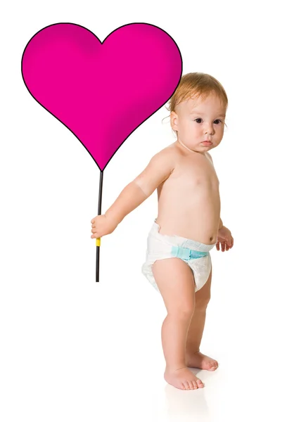 Criança com um coração em um fundo branco — Fotografia de Stock