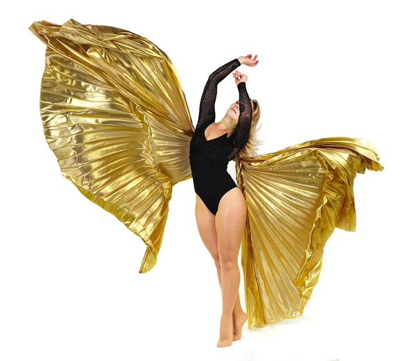Dançarino com asas douradas sobre um fundo branco Fotos De Bancos De Imagens