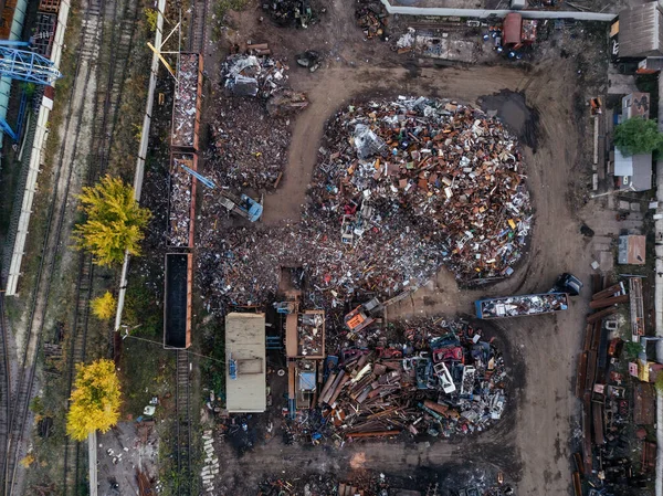 Metal recycling industry. Drone aerial top view of scrap yard.