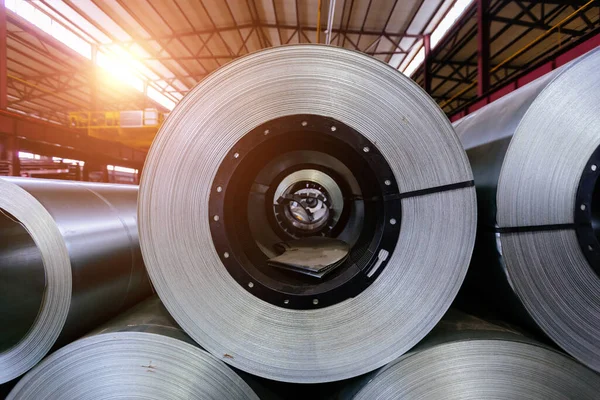 Rolls of galvanized steel sheet inside the factory or warehouse.