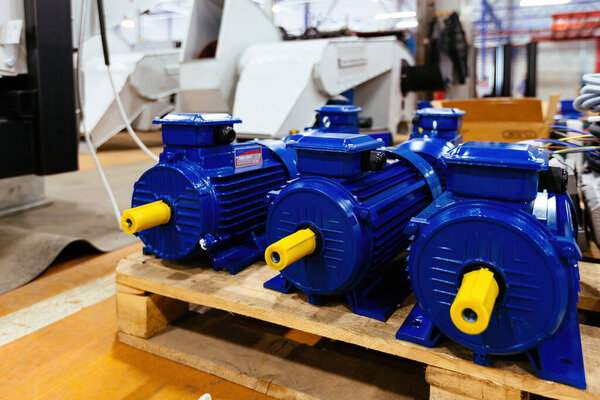 New blue electric motors in the factory for assembling.