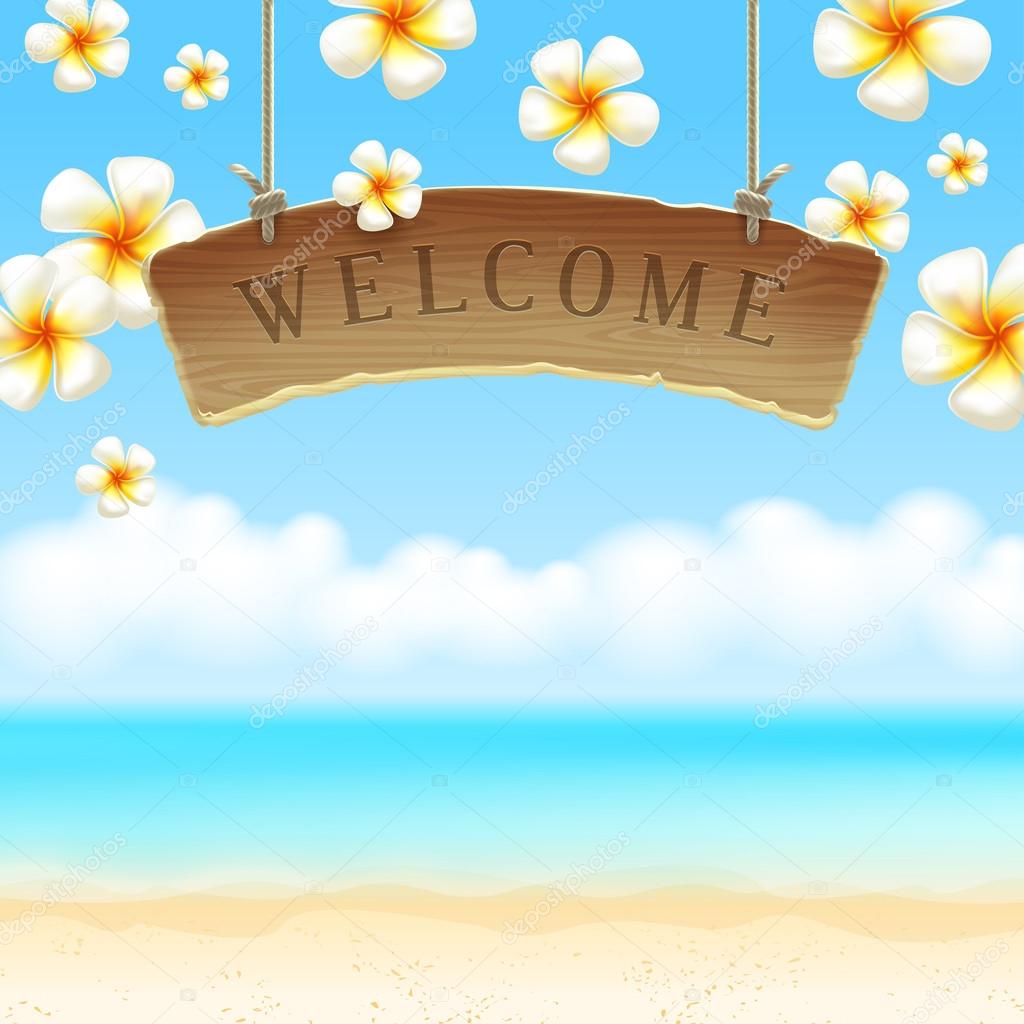 Wooden signboard Welcome hangs against tropical flowers and sea shore