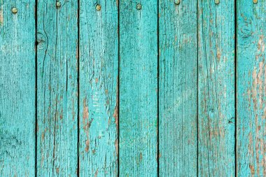 Çatlak boyalı, arka plan desenli eski yeşil ahşap duvar.