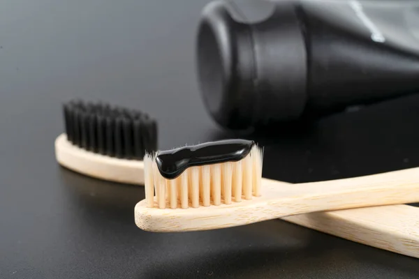 Bamboo Toothbrush Charcoal Paste Black Stone Table Closeup — Stock Photo, Image