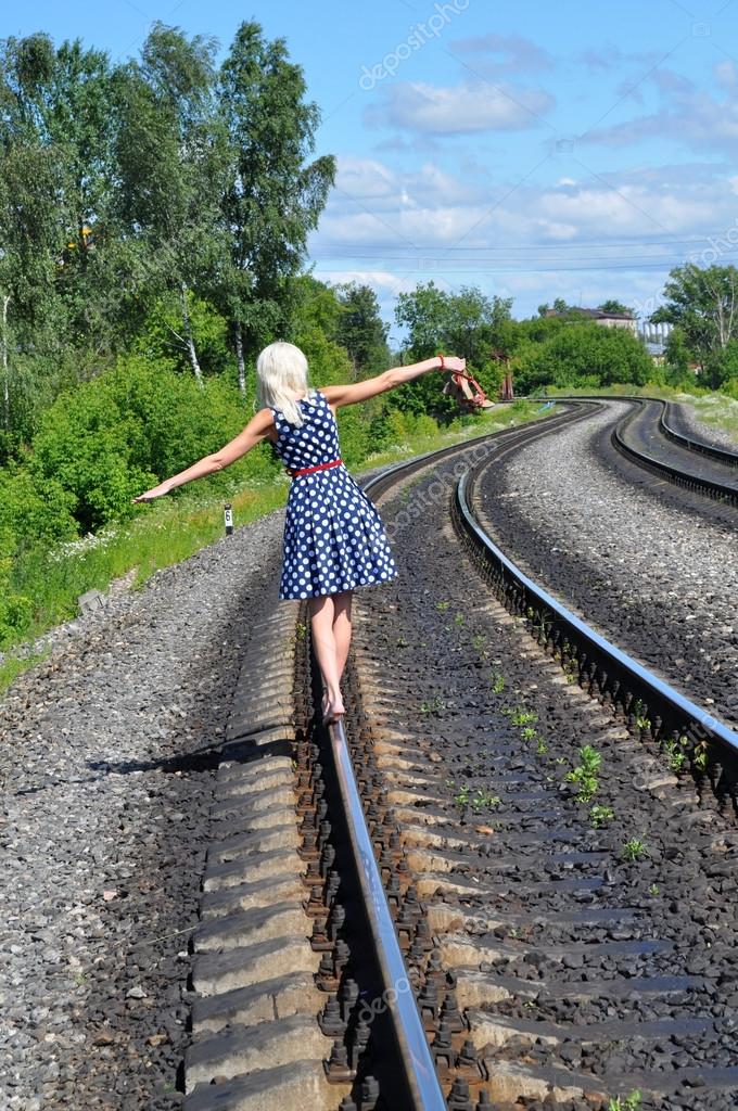 https://st.depositphotos.com/1002626/1812/i/950/depositphotos_18120521-stock-photo-woman-on-the-rail.jpg