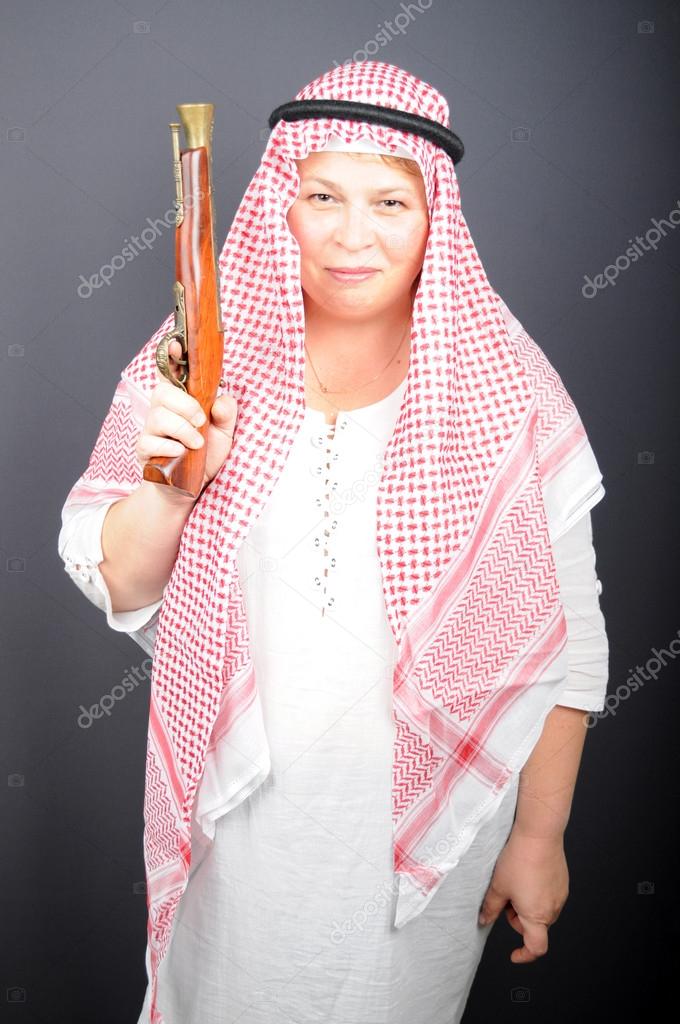 Happy woman with old gun