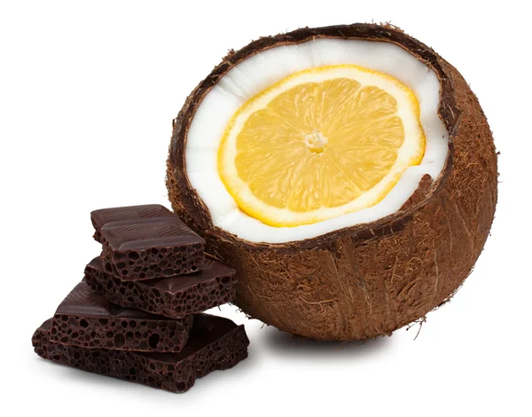 Lemon inside coconut and pieces of chocolate isolated on white — Stock Photo, Image