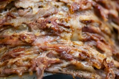 Freshly baked Greek Gyros in fast food restaurant, pork meet and vegetables