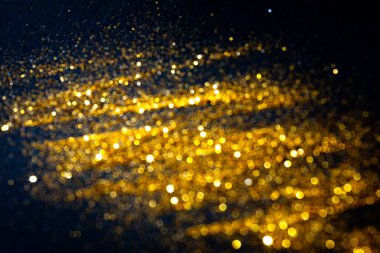 Soyut bulanık Noel arkaplanı. Altın renkli bokeh ışıkları