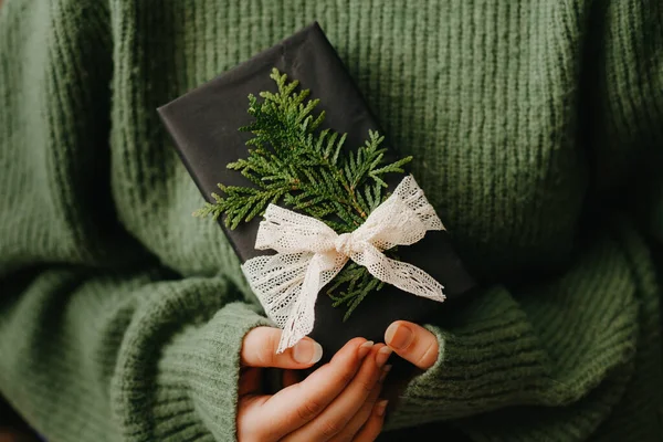 Cozy Christmas present in womans hand, close up — Stock Photo, Image