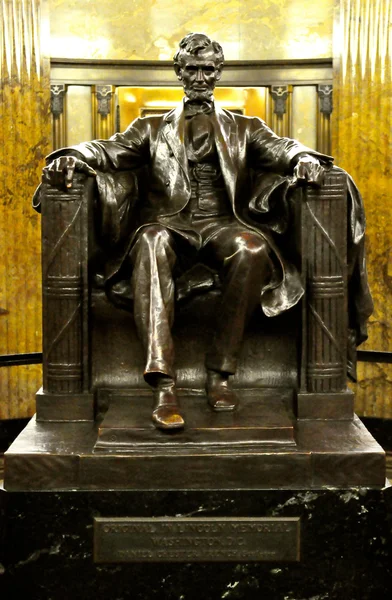 Abraham Lincoln on chair — Stock Photo, Image