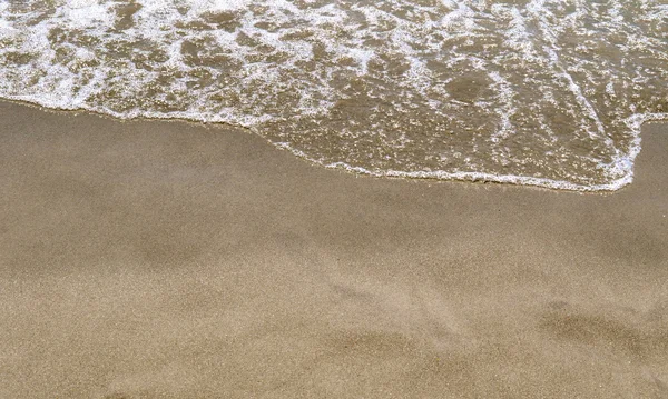 In het zand — Stockfoto