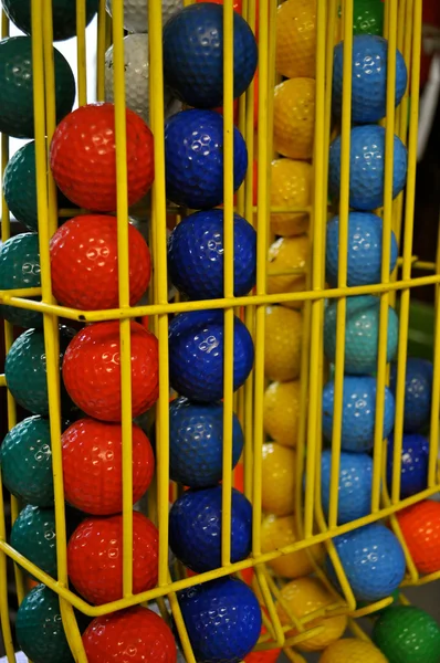 Golf balls in cage — Stock Photo, Image