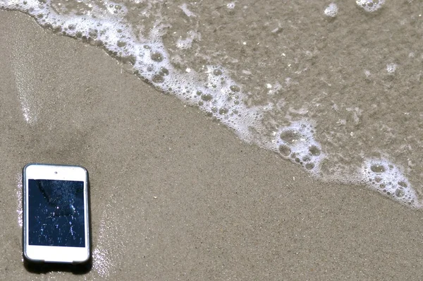 IPod och sand bakgrund - 11 — Stockfoto