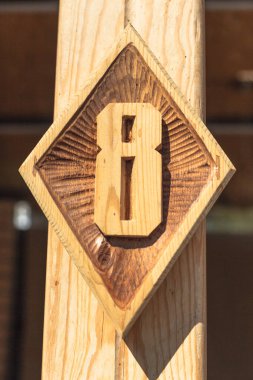 A figure carved from wood in the design of the building. High quality photo