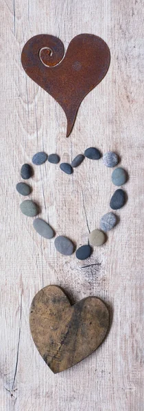 Three Hearts In A Row On Old Wood — Fotografia de Stock